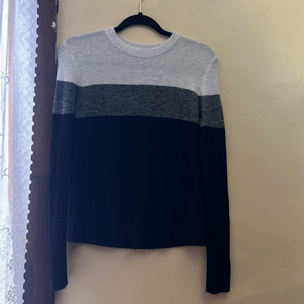 I am selling a neutral colored sweater.
